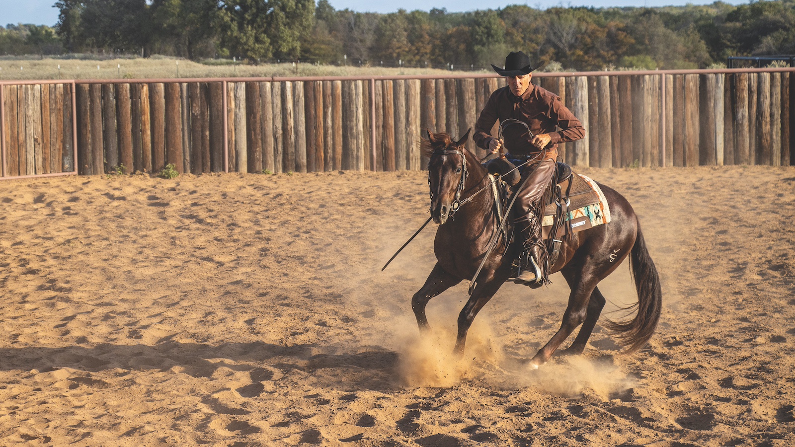 By bringing his outside (right) rein to the horse's neck when turning left, Richard Winters encourages the horse to lift its shoulder and plant its hind feet. Photography by Ross Hecox