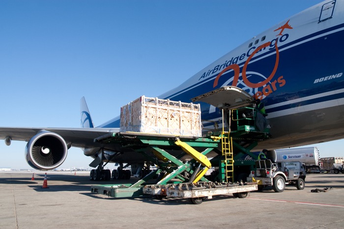 In Chicago, crate of Stevenson's Black Angus cows is loaded onto a 747 cargo airplane, bound for Russia.