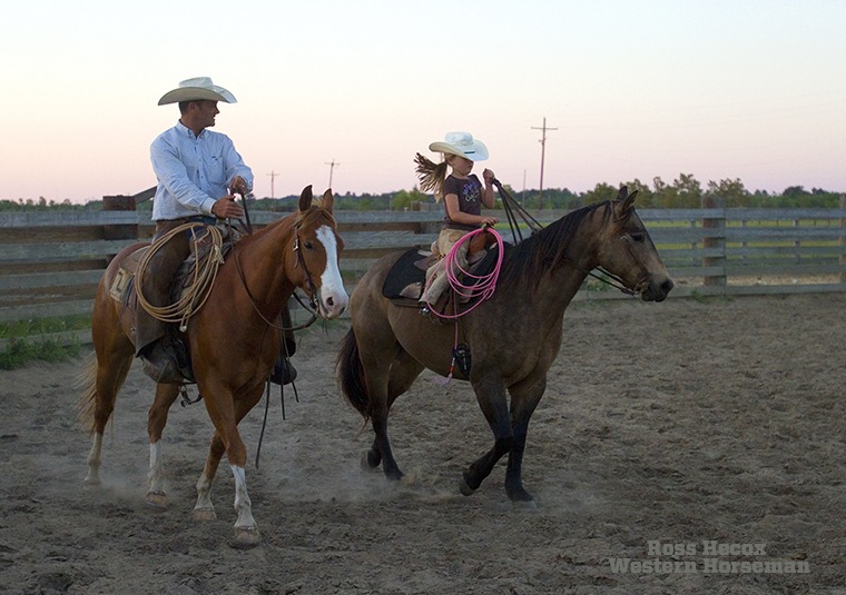 Paxton Ramsey and his daughter, Haidyn, ride together at dusk on the Seven L Ranch on the Texas Gulf Coast. The Ramsey family has ranched in the area since 1904 and today raises commercial cattle and registered Quarter Horses.