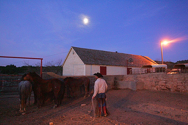 Tim Stout ropes horses on the JA Ranch in 2007.