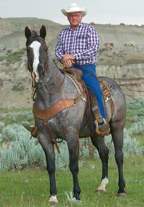 Bill Blakenship, a rancher, pickup man and retired brand inspector, patiently posed for a portrait seconds before a huge hail storm put a damper on our photo shoot.