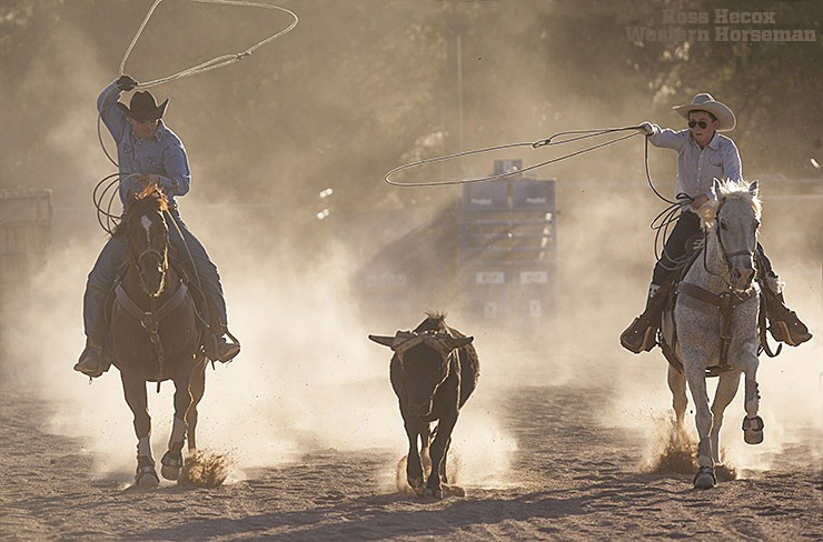 Clint Mortenson ropes with his son, Wyatt, in his arena near Santa Fe, New Mexico. The talented saddle maker and silversmith is also handy on a horse, and his love for being in the saddle is apparently genetic. An article about Mortenson appeared in the August 2015 issue of Western Horseman.