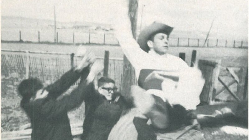 men practicing on a bucking barrel