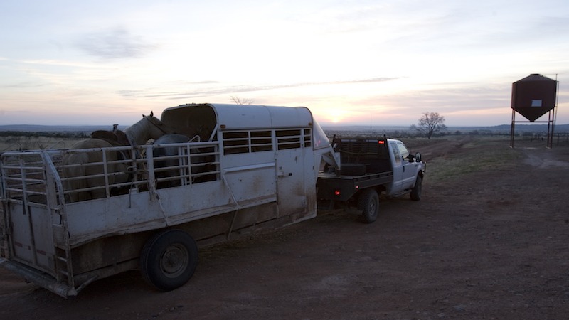 truck pulling half top trailer