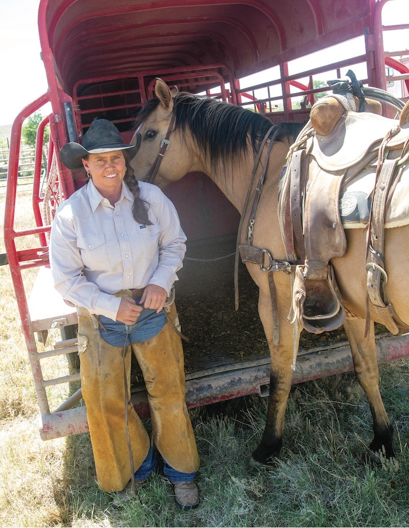 Missy Holmes standing by trailer