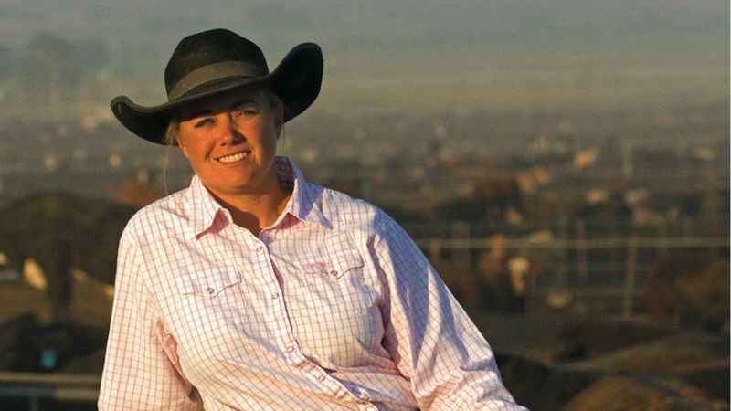 Shawna Mahon in front of feedlot