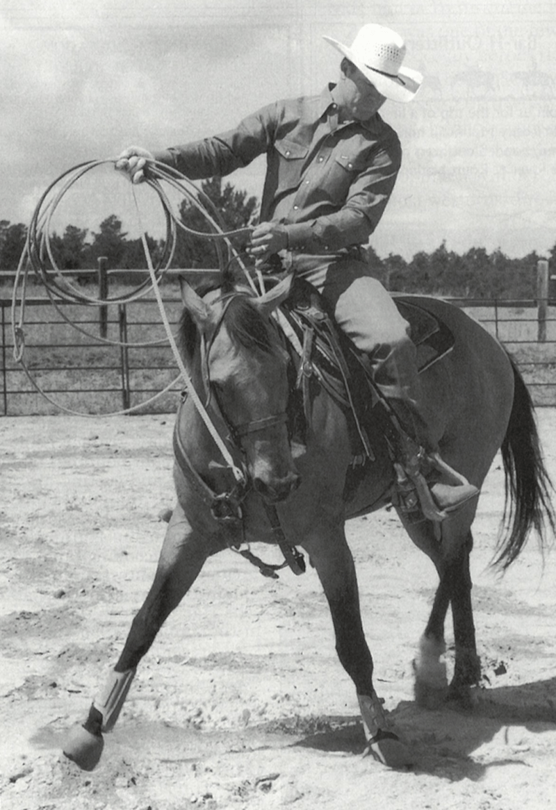 Clay O'brien Cooper with rope riding on horse