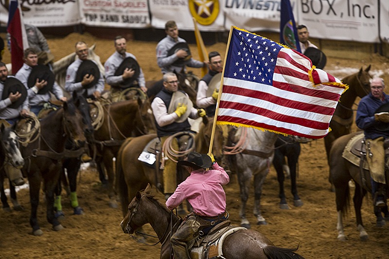 cowboy riding with American flag