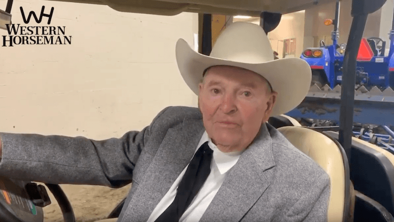 Cotton Rosser sitting in golf car at the Cow Palace
