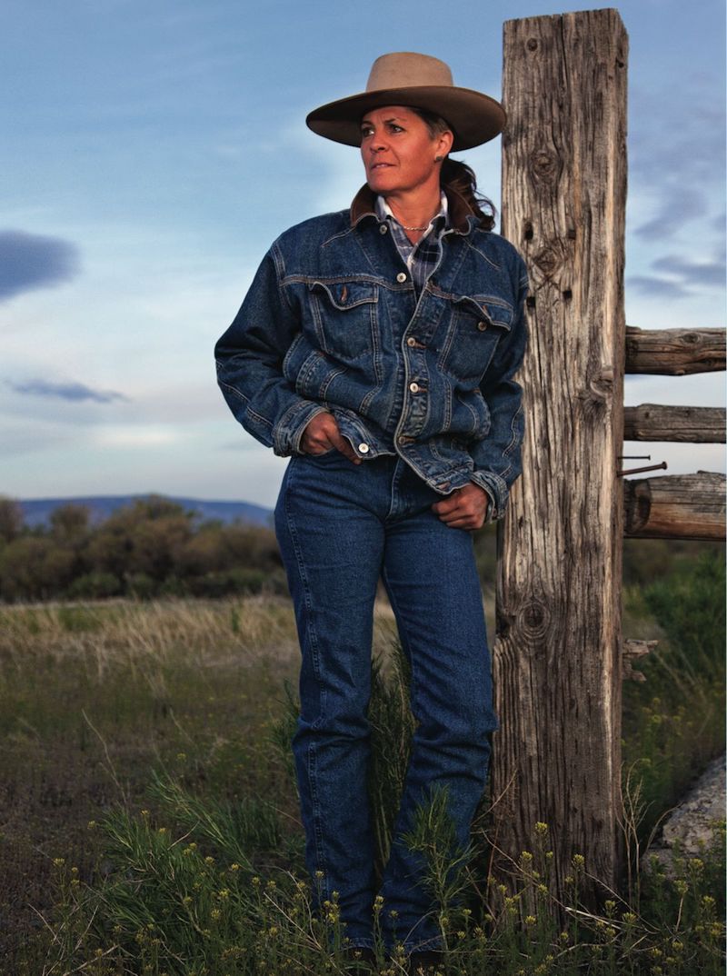 Lisa Robinson standing next to fence post