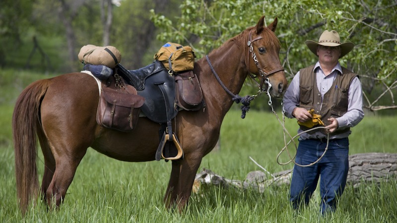 Andy Dean standing next to horse