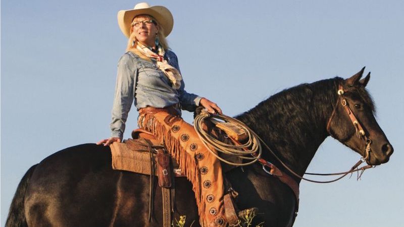 Dawn Newland riding horseback