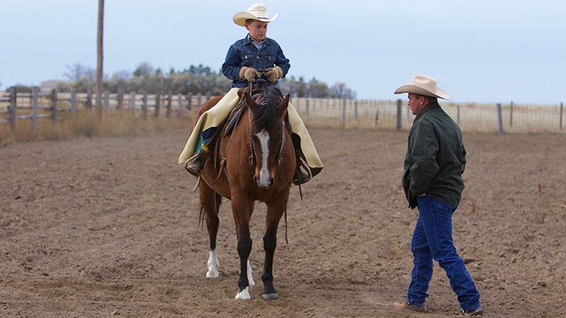 Ken McNabb instructing Jake Gillham on backing up a horse