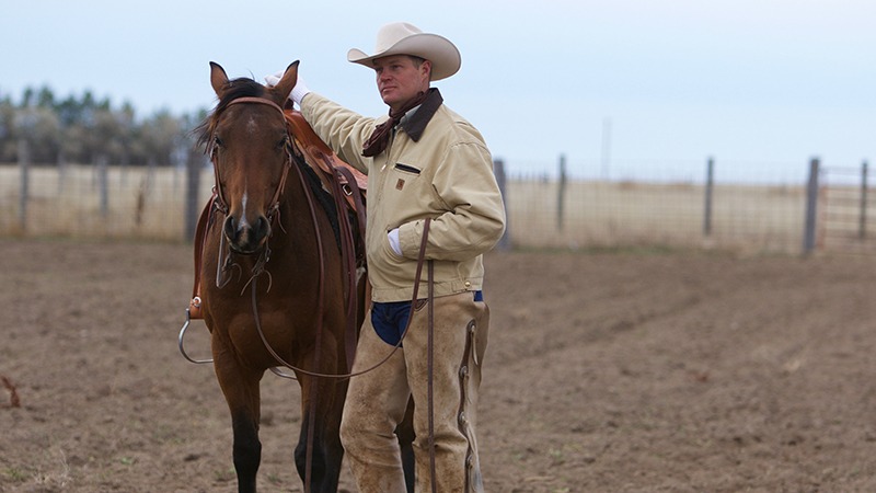 Roy Gillham standing next to horse
