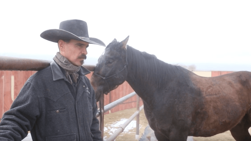 Nick Dowers standing with horse Leroy