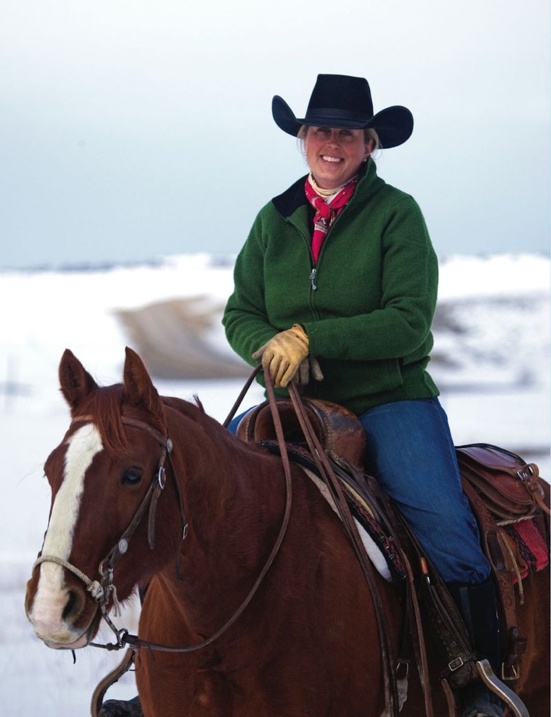 Monique Miller horseback in the snow.