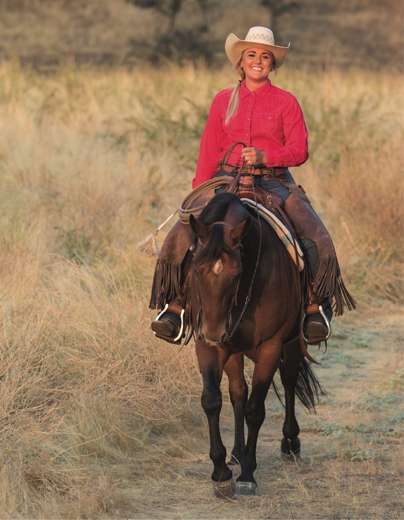 Nicole Courtney Smith riding a bay horse