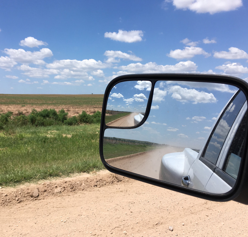 Western Horseman truck looking through side mirror