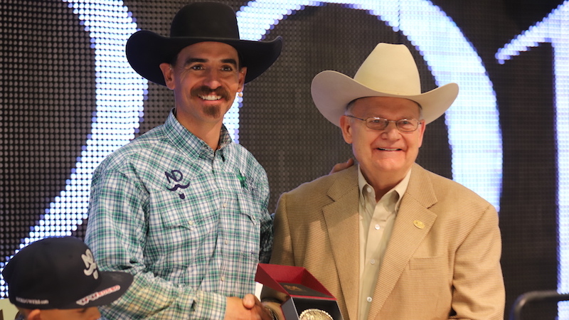 Nick Dowers accepting award from Dr. Glenn Blodgett at Road to the Horse 2019
