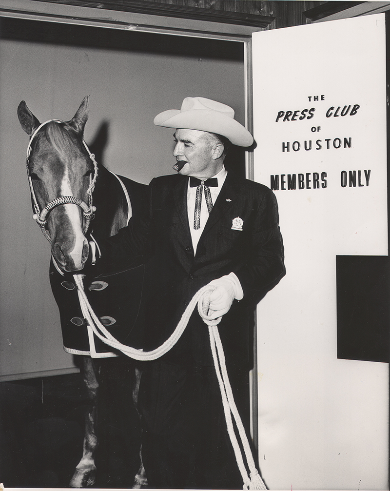 Rex Cauble holding Quarter Horse stallion Cutter Bill at The Press Room in Houston