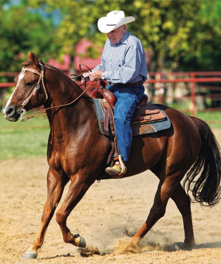 Jack riding a horse for western dressage