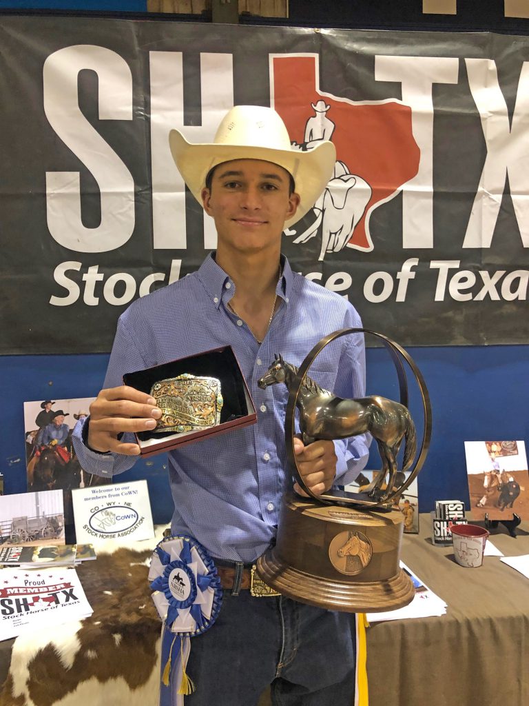 Christopher Lewis holding trophies