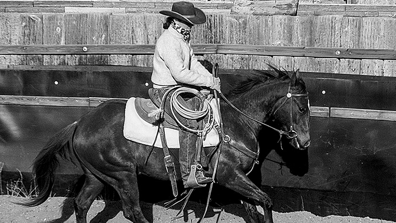 woman loping a horse