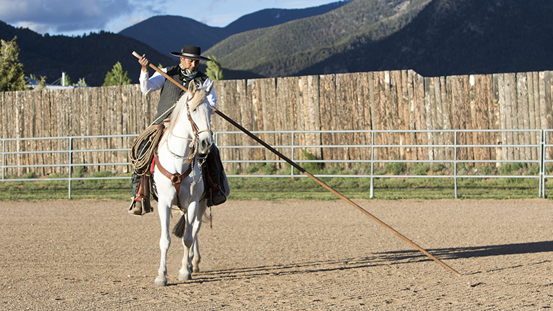 Rudy Lara rides with a garrocha
