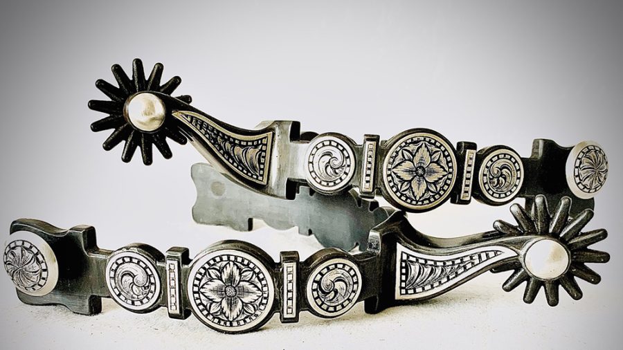 A pair of single-point engraved spurs by Jon Peters.