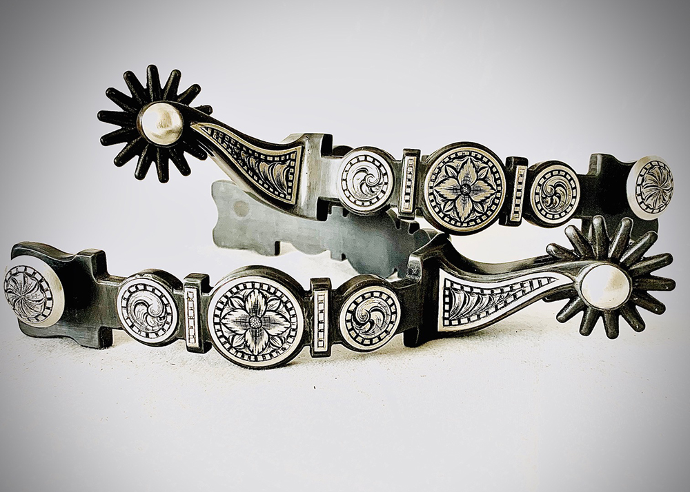 A pair of single-point engraved spurs by Jon Peters.