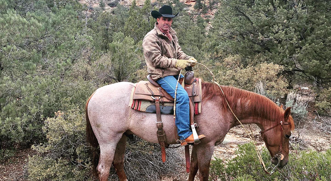 Brady Weavers puts his show horses to work branding calves.