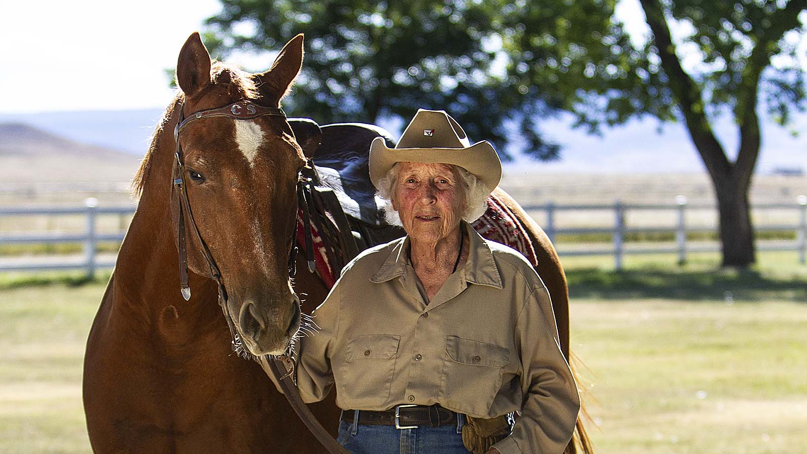 Women of the West Award Winner Linda Davis stands with her horse.