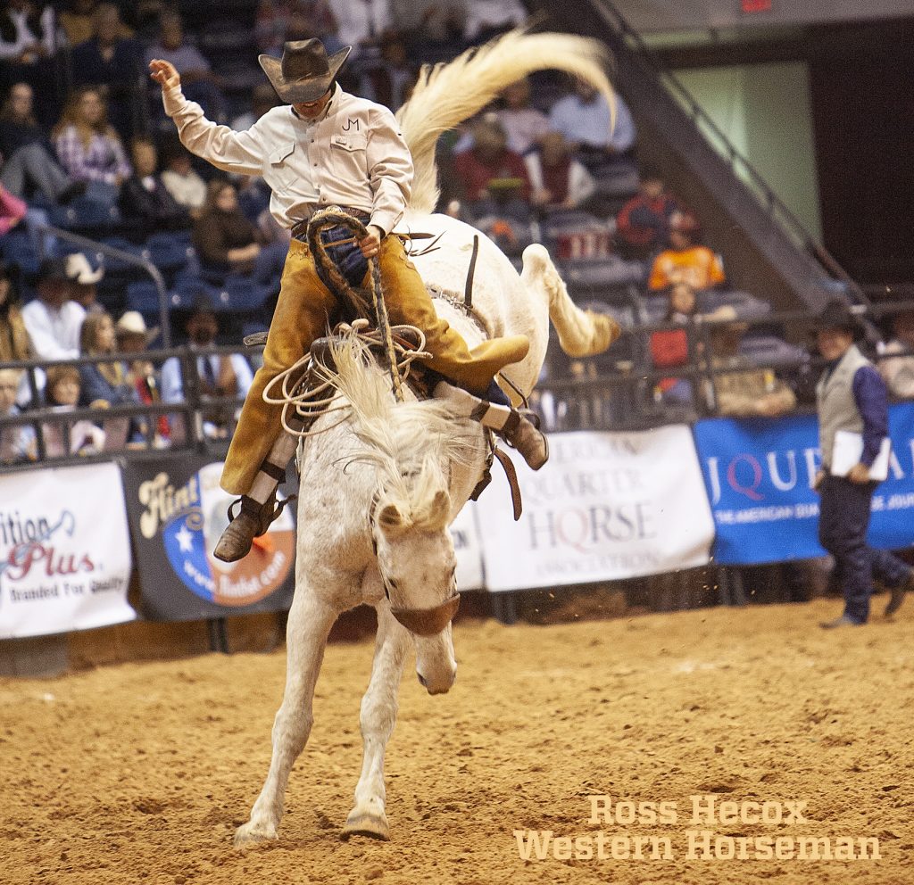 Stonney Jones rides a ranch bronc