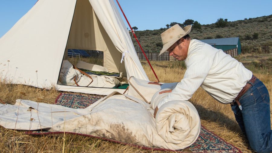 Rolling up a bedroll