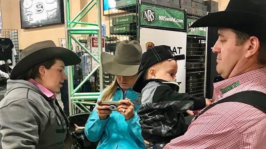 Jackie, Creed and Charly Crawford watching a video with Whitney Desalvo