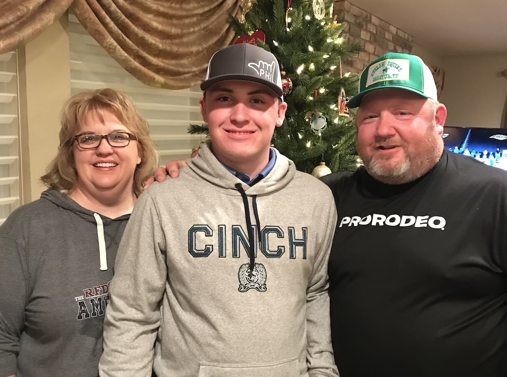 Riley Webb with his parents