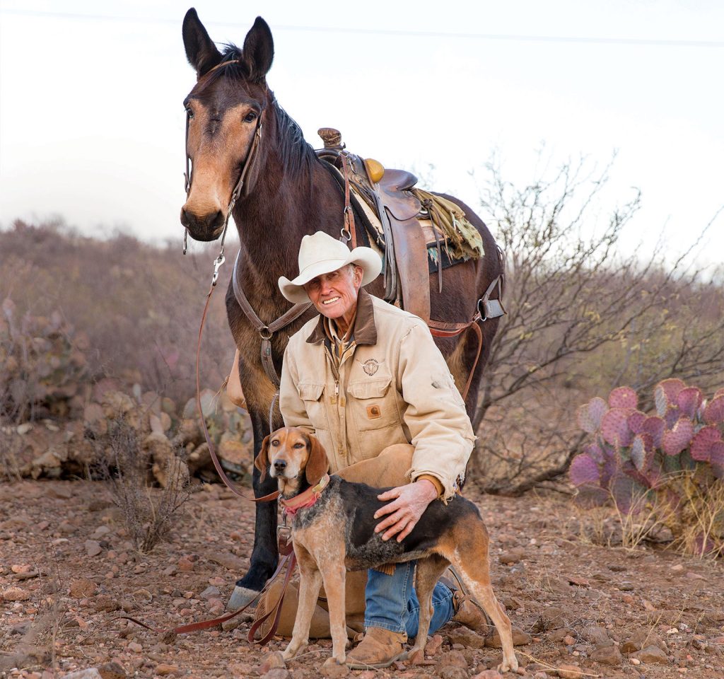 Warner Glenn with his hunting hound, Catchit, and his mule, Brayer.