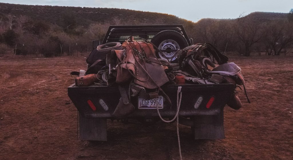 A cowboy's gear on the flatbed.