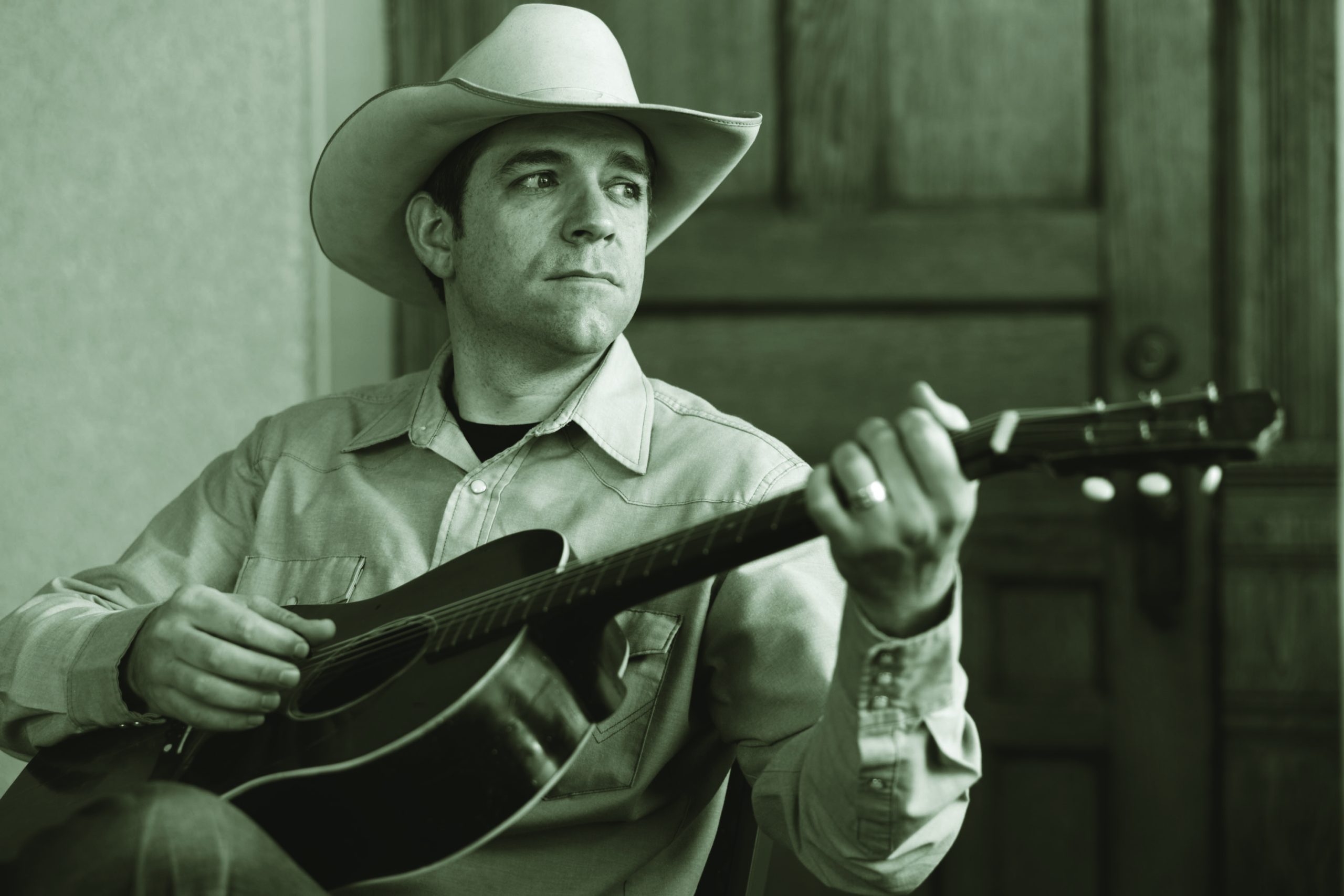 Andy Hedges holding a guitar