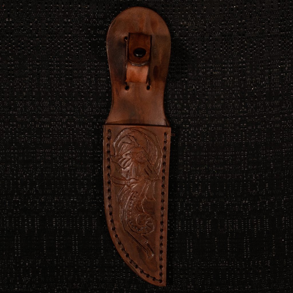 Knife sheath on black background.