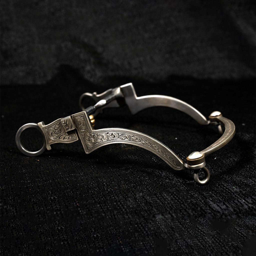 Engraved bit on black background.