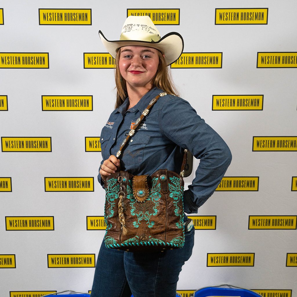 Audrey Fagg holding her handmade purse for the 2023 Western Lifestyle Trade Craft Showcase.