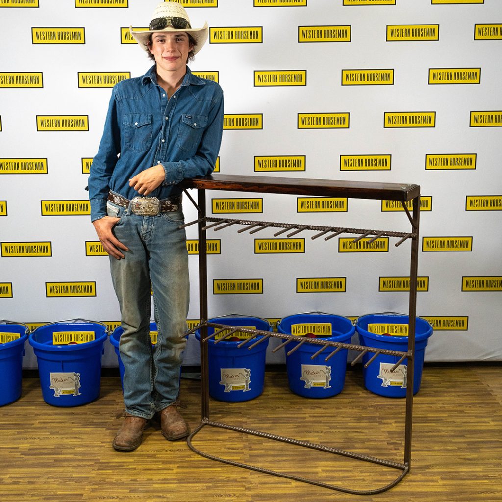Walker Hanafin standing next to his boot rack.