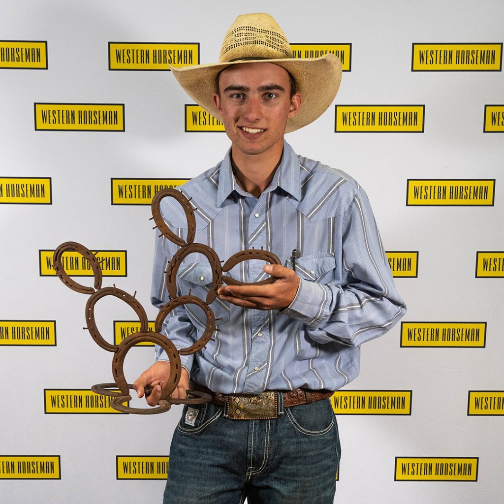 Kass Kimble holding his cactus art.