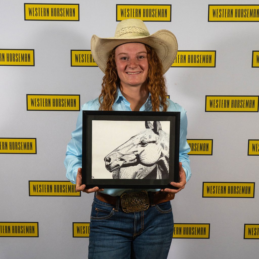 Sadie Rempel with her drawing of a horse.