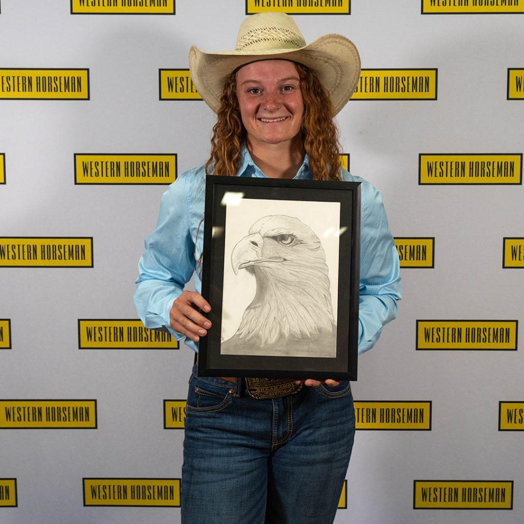 Sadie Rempel with her drawing of an eagle.