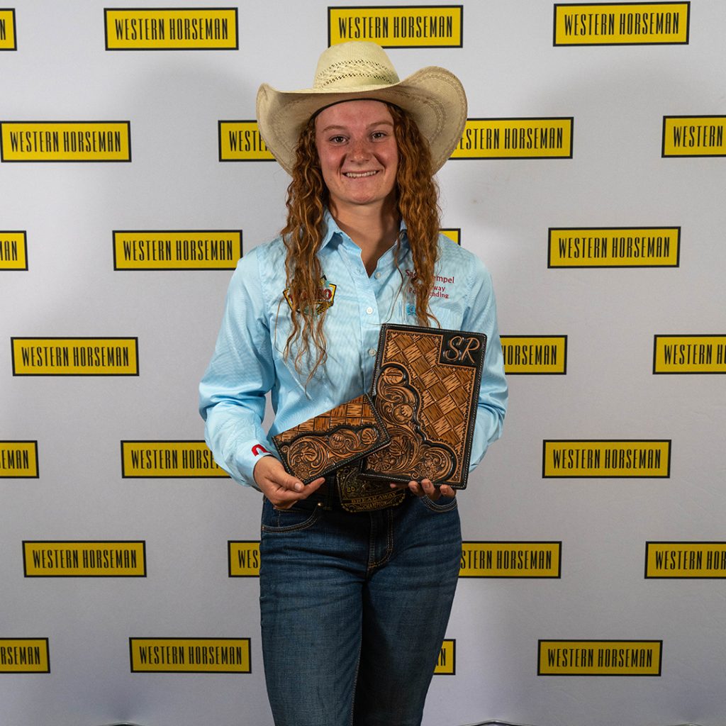 Sadie Rempel with her tooled bible cover and checkbook cover.