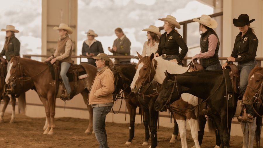 A group of Cal Poly students sit on top of their horses.