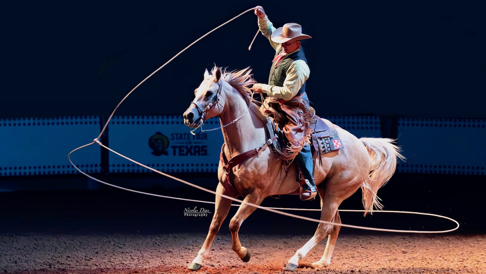 Jerry Diaz swinging a rope around him and his horse at the State Fair of Texas. Photo courtesy of the Diaz family.