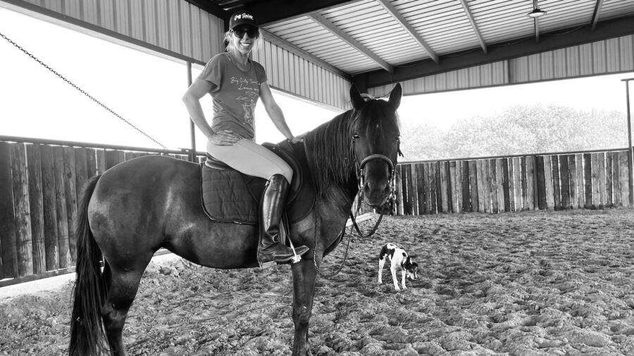 Kelli Neubert on her horse in an English saddle